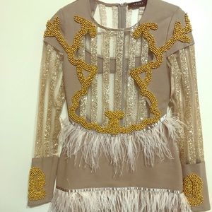 Bodycon gold beaded dress.